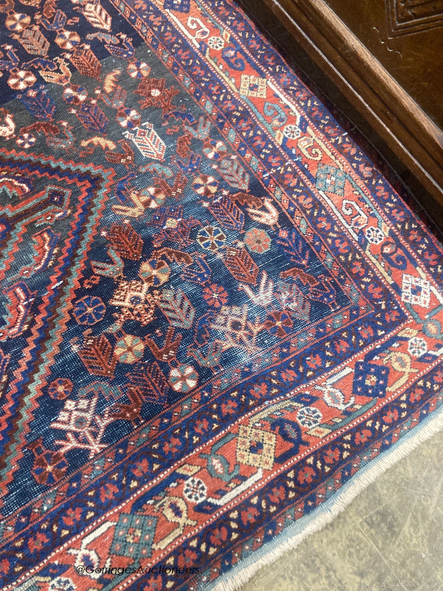 A Caucasian blue ground rug, 188 x 154cm